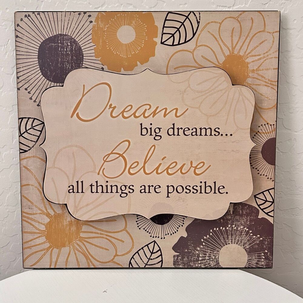 Yellow and Brown “Dream big dreams… Believe all things are possible” sign